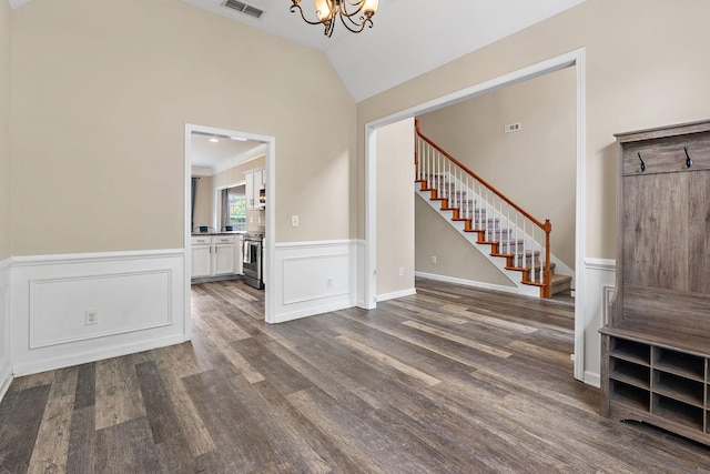 4061 Locerbie Cir, Spring Hill, TN 37174 - foyer entrance featuring stairs, a chandelier, dark wood-type flooring, wainscoting, and vaulted ceiling