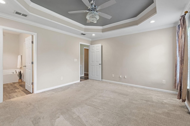 4061 Locerbie Cir, Spring Hill, TN 37174 - unfurnished bedroom with a raised ceiling, carpet floors, crown molding, recessed lighting, and connected bathroom