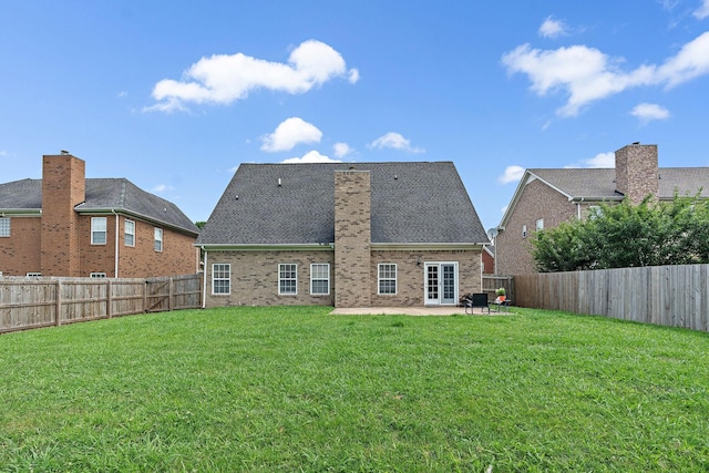4061 Locerbie Cir, Spring Hill, TN 37174 - back of property with a patio area, a fenced backyard, brick siding, and a chimney