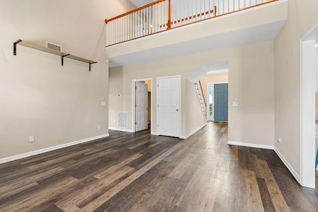 4061 Locerbie Cir, Spring Hill, TN 37174 - unfurnished living room with a high ceiling and dark wood-style flooring