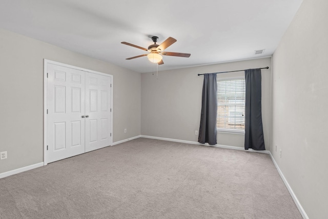 4061 Locerbie Cir, Spring Hill, TN 37174 - unfurnished bedroom featuring carpet, a ceiling fan, and a closet
