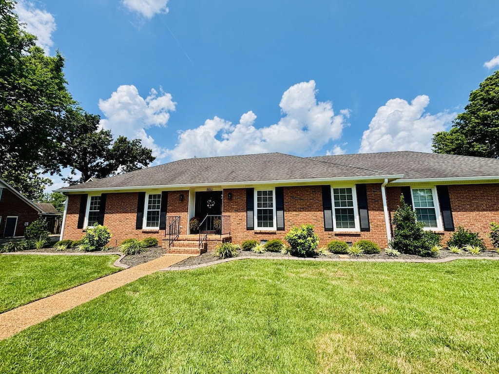 3011 Regency Park Dr, Murfreesboro, TN 37129 - single story home with brick siding, a front lawn, and roof with shingles