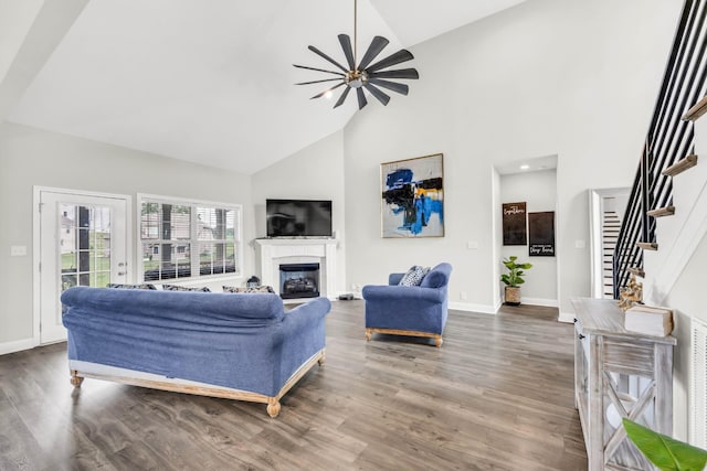 329 Clarabelle Ln, Clarksville, TN 37040 - living area featuring high vaulted ceiling, a fireplace, wood finished floors, a ceiling fan, and stairway