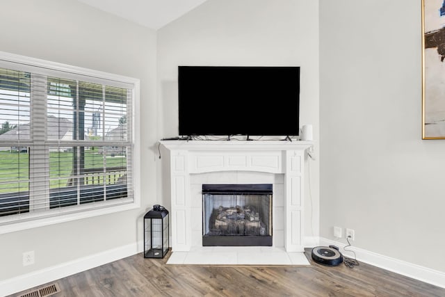 329 Clarabelle Ln, Clarksville, TN 37040 - unfurnished living room featuring wood finished floors, a tile fireplace, and lofted ceiling