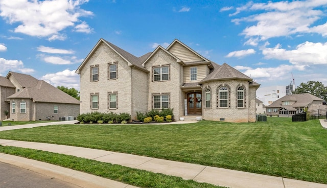 329 Clarabelle Ln, Clarksville, TN 37040 - view of front of home featuring french doors, brick siding, and a front yard