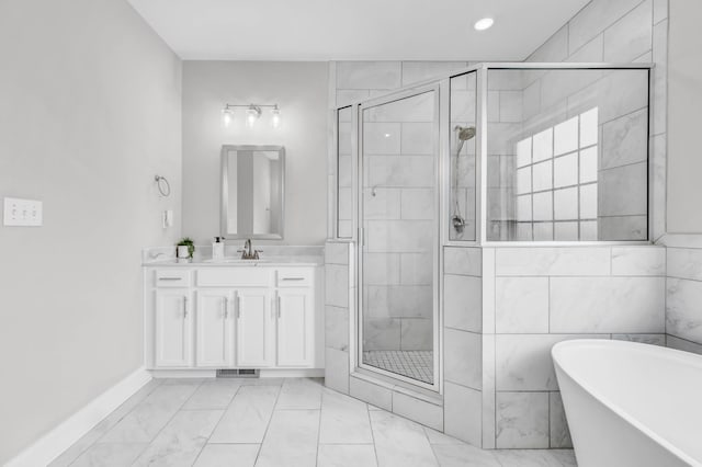 329 Clarabelle Ln, Clarksville, TN 37040 - bathroom with a stall shower, vanity, a soaking tub, marble look tile flooring, and recessed lighting
