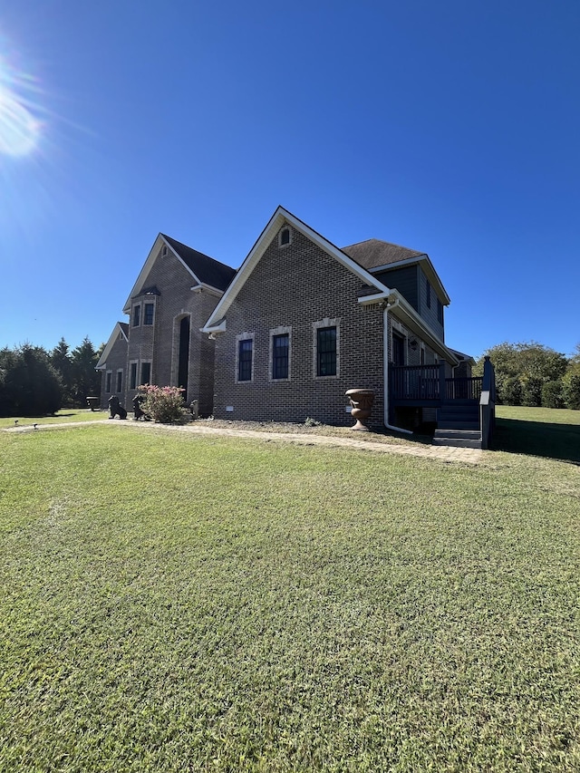 236 Tims Ford Dr, Winchester, TN 37398 - view of side of property with a yard, brick siding, and a wooden deck