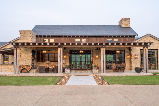 6971 W Cove Rd, Chickamauga, GA 30707 - rear view of house featuring stone siding and a chimney
