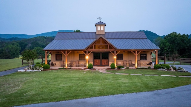 6971 W Cove Rd, Chickamauga, GA 30707 - view of front of property featuring stone siding, covered porch, a mountain view, and a metal roof