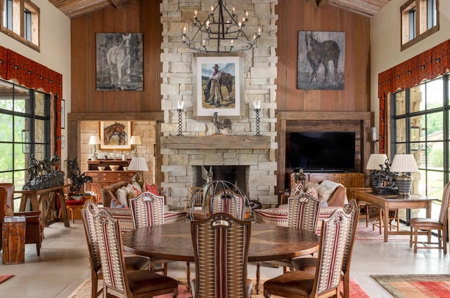 6971 W Cove Rd, Chickamauga, GA 30707 - tiled dining area featuring high vaulted ceiling, a chandelier, wood walls, a stone fireplace, and wood ceiling