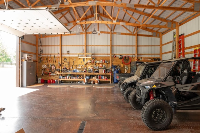 6971 W Cove Rd, Chickamauga, GA 30707 - garage featuring a workshop area and metal wall