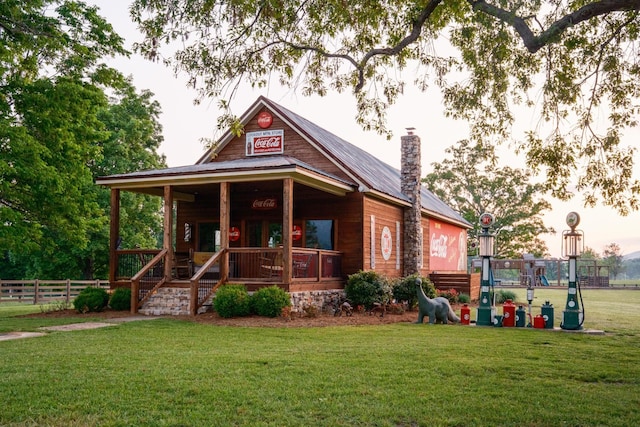 6971 W Cove Rd, Chickamauga, GA 30707 - view of front of house featuring a porch, a chimney, and a metal roof