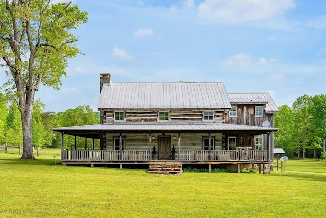 1170 Ascalon Rd, Rising Fawn, GA 30738 - rear view of property featuring a yard, a chimney, a metal roof, and covered porch