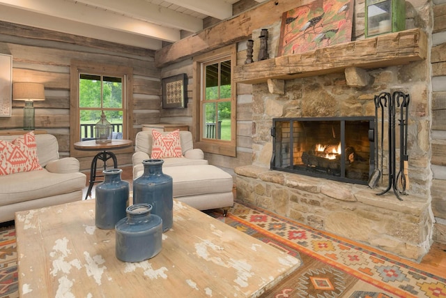 1170 Ascalon Rd, Rising Fawn, GA 30738 - living room featuring wooden walls, beam ceiling, and a stone fireplace