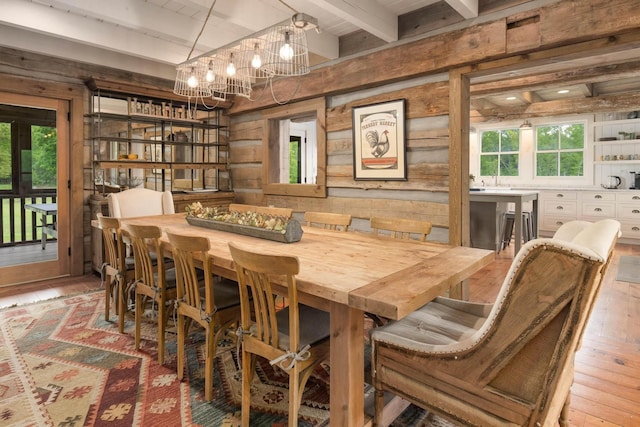 1170 Ascalon Rd, Rising Fawn, GA 30738 - dining area featuring beam ceiling, wooden walls, a chandelier, and wood-type flooring