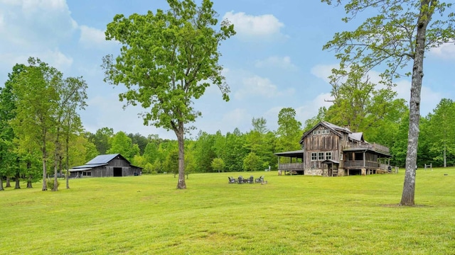 1170 Ascalon Rd, Rising Fawn, GA 30738 - view of grassy yard with a barn, an outdoor structure, and view of wooded area
