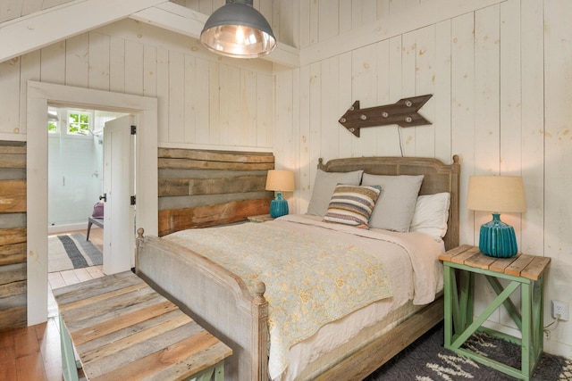 1170 Ascalon Rd, Rising Fawn, GA 30738 - bedroom featuring wooden walls, wood finished floors, and vaulted ceiling
