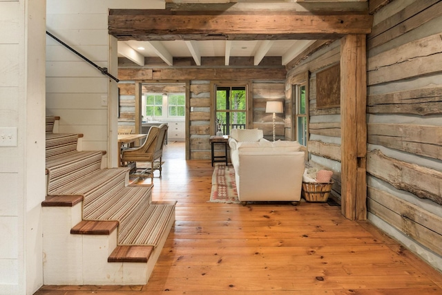 1170 Ascalon Rd, Rising Fawn, GA 30738 - living area with beam ceiling, wood-type flooring, wood walls, and stairs