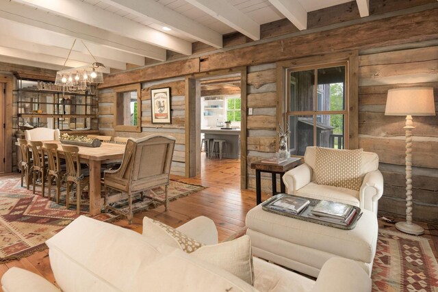1170 Ascalon Rd, Rising Fawn, GA 30738 - living area with healthy amount of natural light, hardwood / wood-style floors, a chandelier, beamed ceiling, and wooden walls
