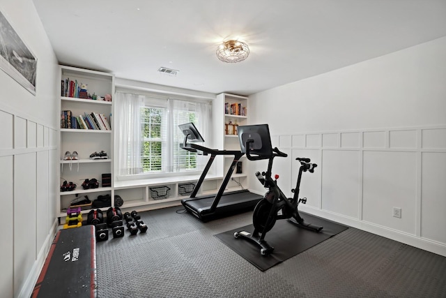 1209 Firth Ct, Franklin, TN 37067 - workout room with a decorative wall, carpet flooring, and wainscoting