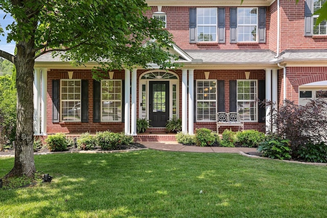 1209 Firth Ct, Franklin, TN 37067 - view of front of property with brick siding, a porch, and a front lawn