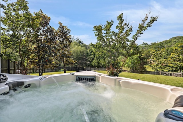 1209 Firth Ct, Franklin, TN 37067 - view of swimming pool with a hot tub and a fenced backyard