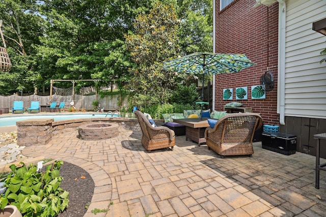 1209 Firth Ct, Franklin, TN 37067 - fenced backyard featuring an outdoor living space with a fire pit and a patio area