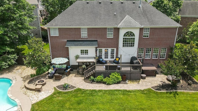 1209 Firth Ct, Franklin, TN 37067 - rear view of house featuring a patio area, an outdoor living space with a fire pit, a deck, and a yard