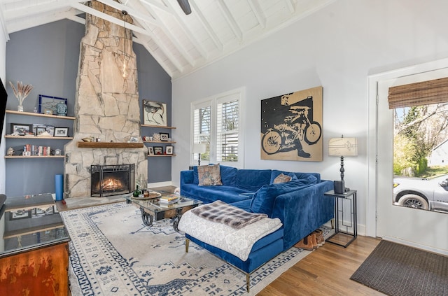 805 Allison Gdns, Columbia, TN 38401 - living area featuring beamed ceiling, wood finished floors, a stone fireplace, and high vaulted ceiling