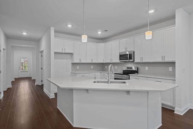1551 Cedarbrooke Ln, Lebanon, TN 37090 - kitchen with stainless steel appliances, white cabinetry, backsplash, and recessed lighting