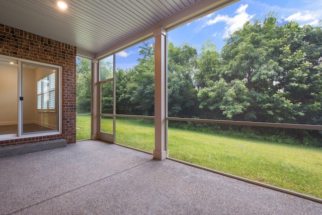 1551 Cedarbrooke Ln, Lebanon, TN 37090 - unfurnished sunroom featuring brick wall and view of wooded area