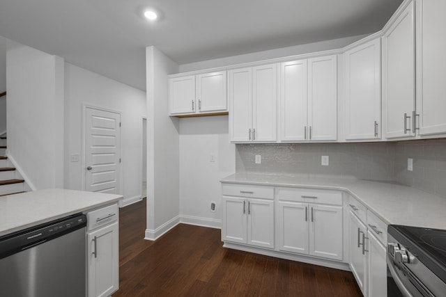 1551 Cedarbrooke Ln, Lebanon, TN 37090 - kitchen with stainless steel appliances, white cabinetry, dark wood-style floors, decorative backsplash, and recessed lighting