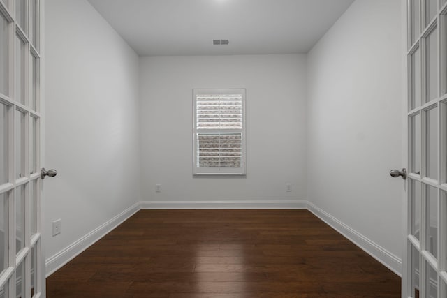 1551 Cedarbrooke Ln, Lebanon, TN 37090 - empty room featuring french doors and dark wood-type flooring