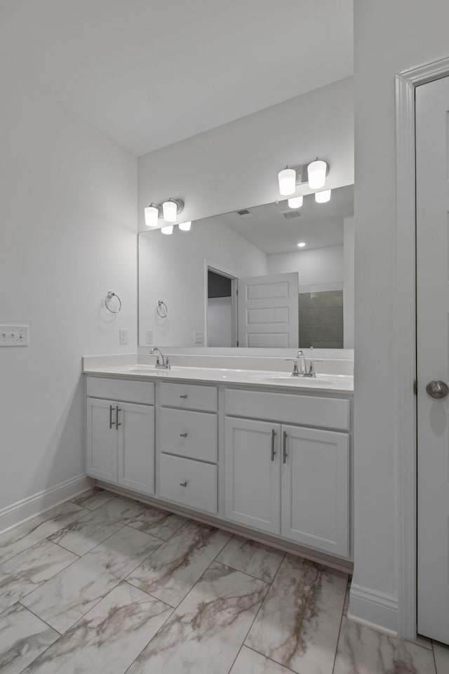 1551 Cedarbrooke Ln, Lebanon, TN 37090 - bathroom with double vanity, marble finish floors, and tiled shower