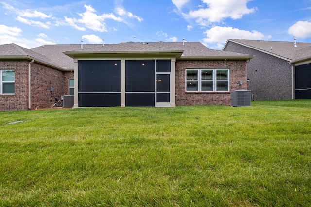 1551 Cedarbrooke Ln, Lebanon, TN 37090 - rear view of property with brick siding, a sunroom, and a lawn
