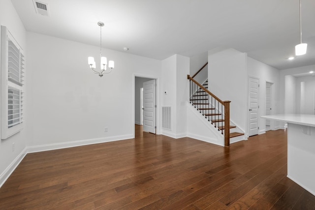 1551 Cedarbrooke Ln, Lebanon, TN 37090 - unfurnished living room featuring stairs, dark wood-style flooring, and a chandelier