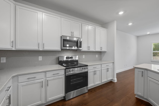 1551 Cedarbrooke Ln, Lebanon, TN 37090 - kitchen with stainless steel appliances, tasteful backsplash, dark wood-style floors, white cabinetry, and recessed lighting