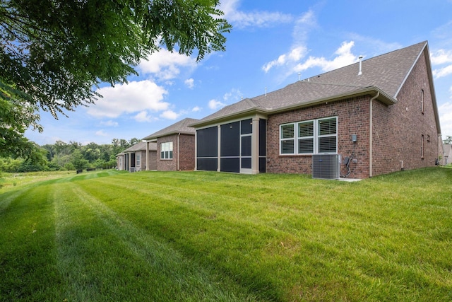 1551 Cedarbrooke Ln, Lebanon, TN 37090 - back of house with brick siding, a lawn, and roof with shingles
