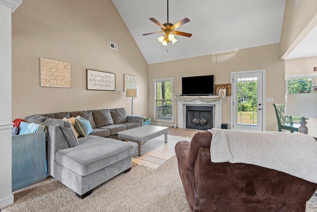 1372 Tidwell Switch Rd, Dickson, TN 37055 - living area featuring high vaulted ceiling, a ceiling fan, a fireplace, healthy amount of natural light, and carpet floors