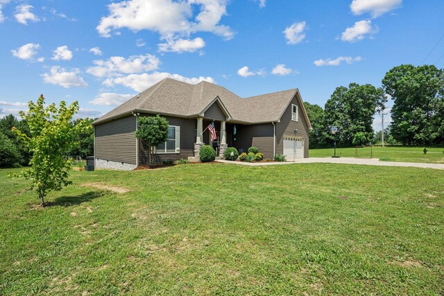1372 Tidwell Switch Rd, Dickson, TN 37055 - view of front facade featuring concrete driveway, a garage, and a front yard