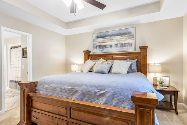423 Adeline Dr, Smyrna, TN 37167 - bedroom featuring light colored carpet, a tray ceiling, a ceiling fan, and light tile patterned flooring