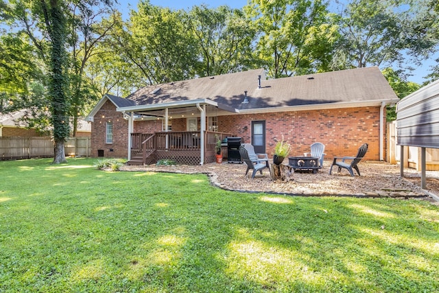 423 Adeline Dr, Smyrna, TN 37167 - rear view of house with a deck, brick siding, a shingled roof, and a fire pit