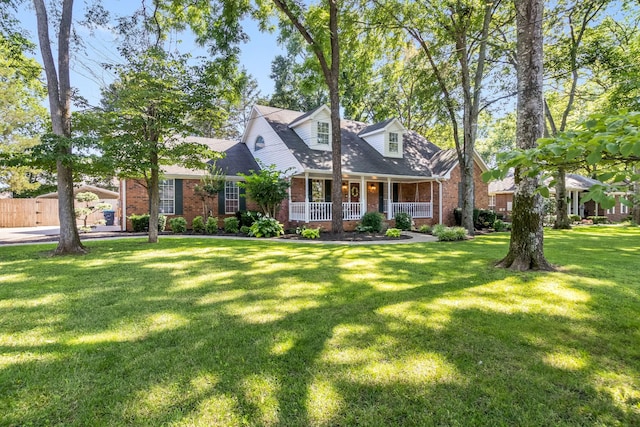 423 Adeline Dr, Smyrna, TN 37167 - cape cod-style house featuring brick siding, covered porch, and a front lawn