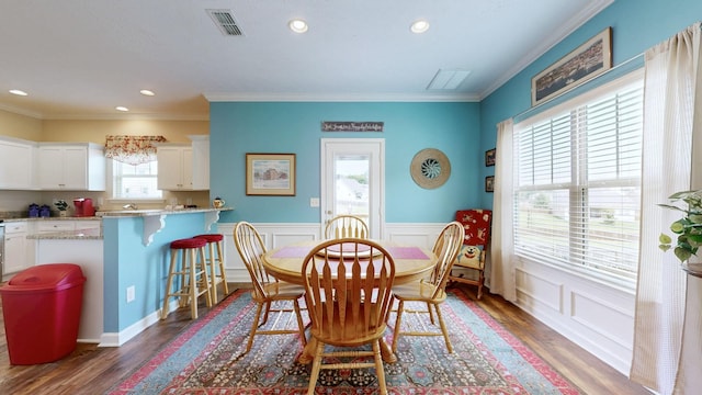 1095 Lady Nashville Dr, Hermitage, TN 37076 - dining space featuring wood finished floors, ornamental molding, a wainscoted wall, recessed lighting, and a decorative wall