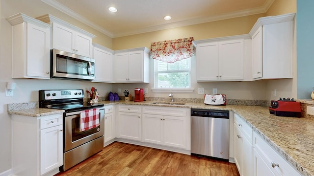 1095 Lady Nashville Dr, Hermitage, TN 37076 - kitchen featuring stainless steel appliances, white cabinets, crown molding, light wood-style flooring, and recessed lighting