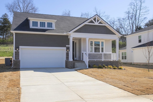 3044 Fernwood Ln, Columbia, TN 38401 - craftsman house with a porch, concrete driveway, a garage, and roof with shingles