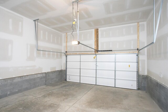 3044 Fernwood Ln, Columbia, TN 38401 - garage featuring a garage door opener and concrete block wall