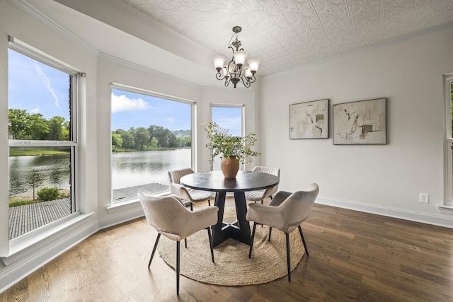 321 Lakeway Ter, Spring Hill, TN 37174 - dining room with crown molding, a chandelier, a water view, wood finished floors, and an ornate ceiling
