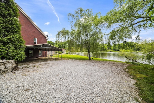 321 Lakeway Ter, Spring Hill, TN 37174 - view of yard featuring a water view, a carport, and driveway