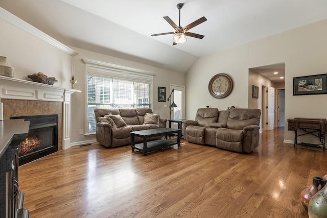 1057 The Long Run, Columbia, TN 38401 - living area featuring a fireplace, a ceiling fan, wood finished floors, and vaulted ceiling